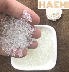 Transparent hot melt adhesive pellets for pearl cotton